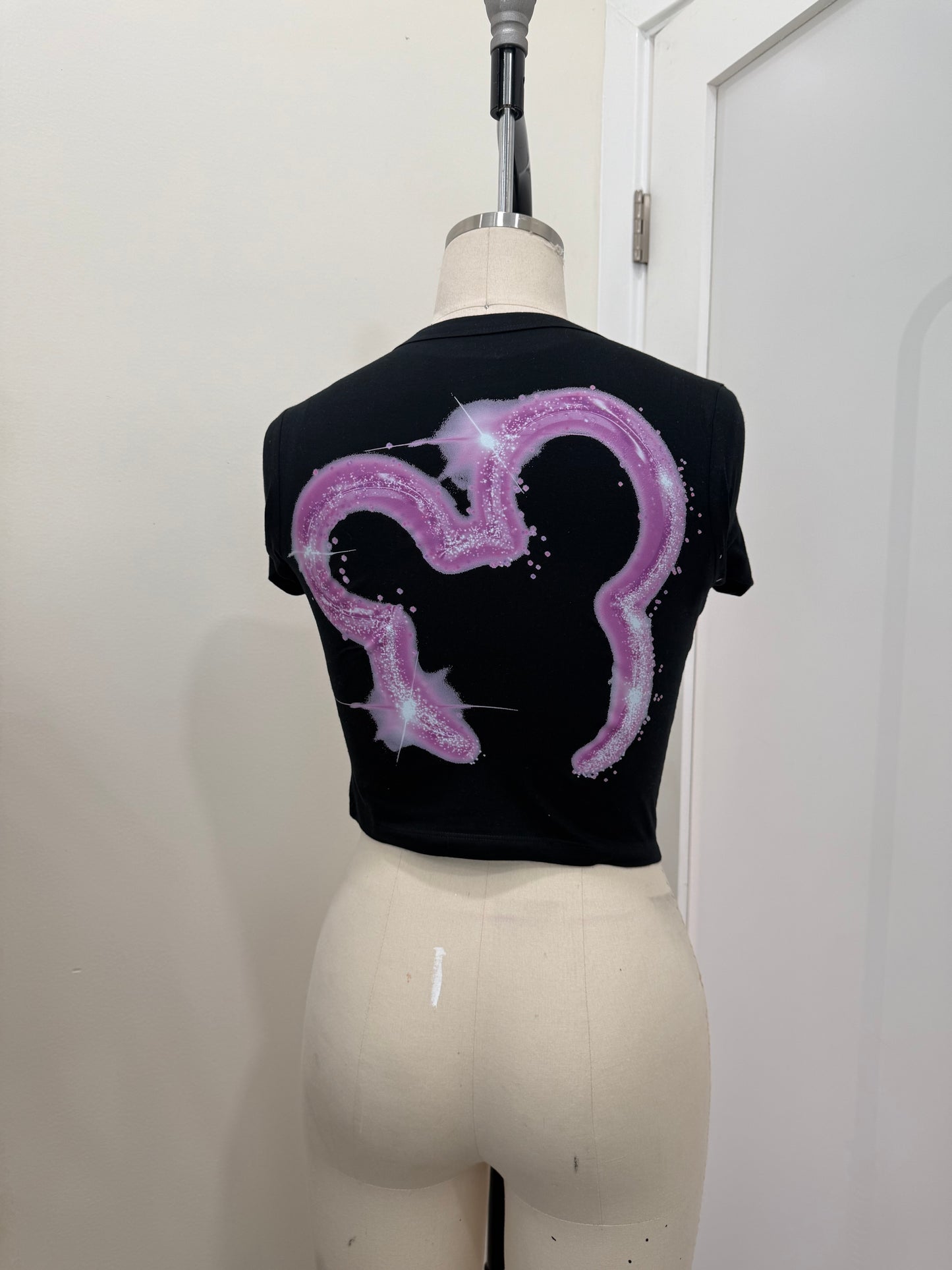 YOUR WATCHING DC PINK BABY TEE